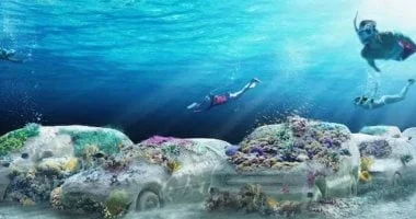 صورة سيارات خرسانية تتحول إلى شعاب مرجانية في حديقة تحت الماء بميامي